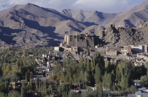 INDIA, Ladakh, Leh, Hillside palace overlooking the town surrounded by mountainous terrain