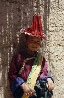 CHINA,  , Qinghai, Young Tibetan boy dressed in festival dancing costume