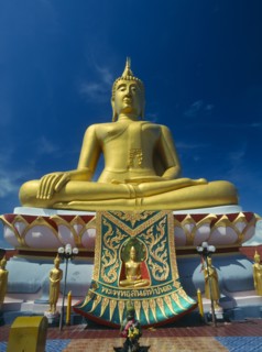 THAILAND, North, Koh Samui, Big Buddha Beach. Seated golden Big Buddha statue