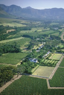SOUTH AFRICA, Cape Province, Boschendal Estate Wine Estate.  Aerial view over vineyards and winery