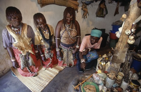 SOUTH AFRICA, KwaZulu Natal , Hlabisa, Zulu Sangomas or female diviners kneeling in their