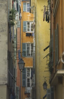 FRANCE, Prov Cote D’Azur  , Nice, Old Port Area narrow alley way with flat windows and washing