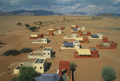 NAMIBIA, Namib Dessert, Sussusvlei, Karos Lodge. View over cluster of Hotel buildings on the edge