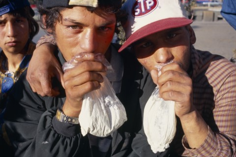 BULGARIA, Sofia, Solvent Abuse. Two gypsy boys sniffing glue from plastic bags