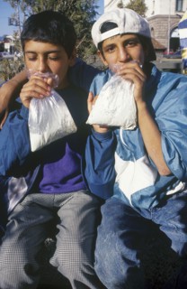 BULGARIA, Sofia, Two gypsy boys sniffing glue from plastic bags