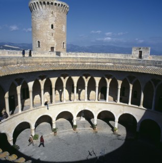 SPAIN, Balearic Islands, Majorca, Palma. View over Bellver Castle courtyard Mountains in distance