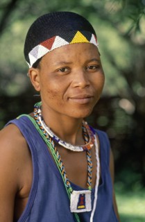 SOUTH AFRICA, KwaZulu Natal, Melmoth, Zulu woman wearing head band and necklace of beads that