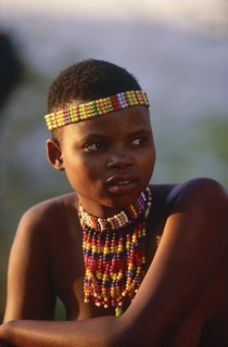 SOUTH AFRICA, KwaZulu Natal, Shakaland , Zulu woman with an ujelasi necklace and head band