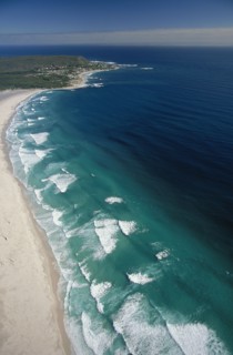 SOUTH AFRICA, Cape Province, Cape Town, View along Noordhoek Beach with waves rolling into the
