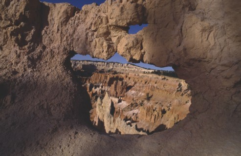 USA, Utah, Bryce Canyon National Park , View through natural arch toward valley of colourful rock