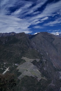 PERU, Cusco, Machu Picchu, Aerial view over mountain landscape with hilltop Inca city ruins