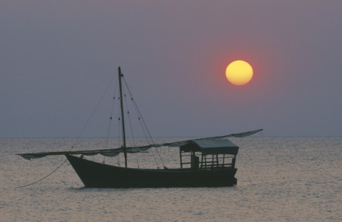 TANZANIA, Lake Tanganyika, Sunset with dhow at anchor