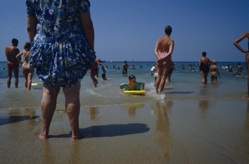 FRANCE, Aquitaine, Pyrenees Atlantiques, Biarritz.  Busy beach scene with people standing and