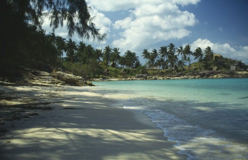THAILAND, Koh Pha-Ngan Island, Coral Bay.  View along sandy beach toward bay with surrounding rocks