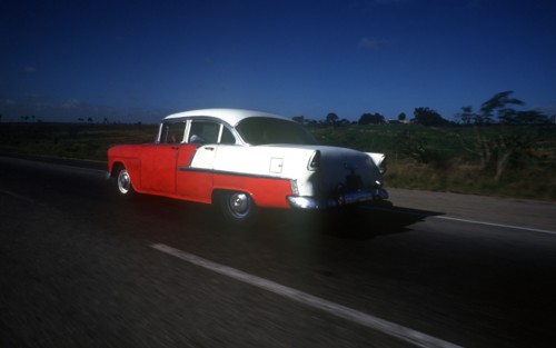 CUBA, Pinar Del Rio, Transport, Old red and white coloured 1950s US car