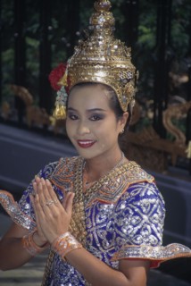 THAILAND, Bangkok, Female Temple dancer in traditional dress outside Grand Hyatt Erawan Hotel