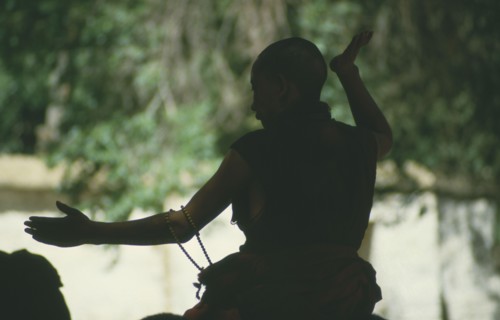 TIBET, Lhasa, Silhouette of debating monk