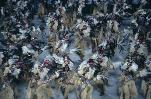 BRAZIL, Rio De Janeiro , Carnival procession with dancers wearing glittering feathered costumes