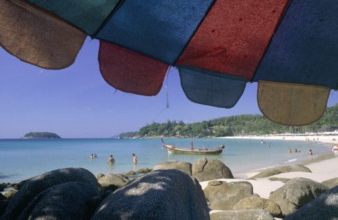THAILAND, Phuket, Kata Noi Beach, "Little Kata Beach seen from beneath a colourful umbrella with
