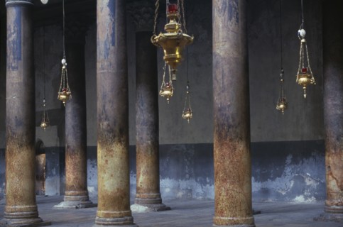 ISRAEL,  , Bethlehem, The Church Of The Nativity limestone pillars with candle holders hanging down