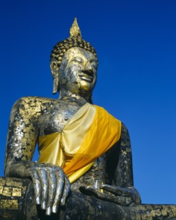 THAILAND, Central Plains, Sukhothai, Satue of buddha on temple-gold and yellow sash