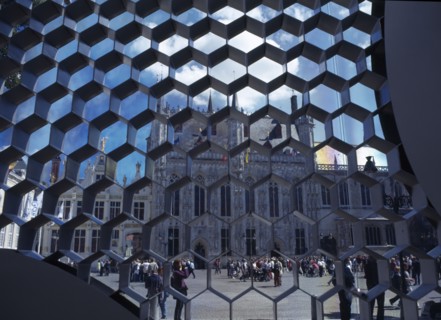 BELGIUM, West Flanders, Bruges, Burg Square with the Stadhuis seen through honeycombe detail of