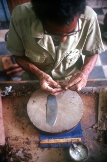CUBA, Sancti Spiritus, Trinidad, Detail of worker rolling a cigar in factory