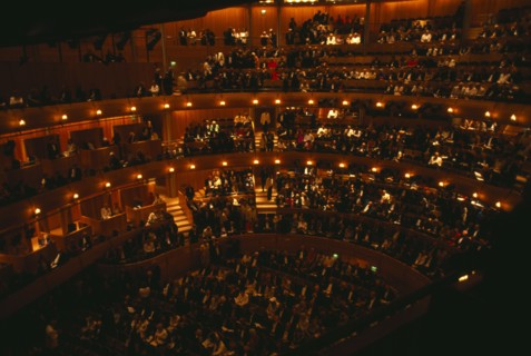 ENGLAND, East Sussex, Glyndebourne, Interior of auditorium with audience members taking their seats