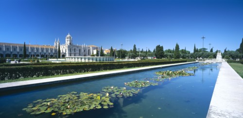 PORTUGAL, Estremadura, Lisbon, Jeronimos Monastery with waterlilly pool in foreground.