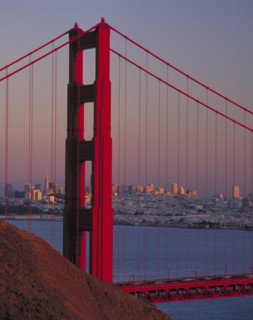 USA, California, San Francisco, Golden Gate Bridge at dusk with city behind