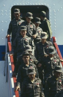 CUBA, Military, Soldiers descending steps of a plane after returning from Angola