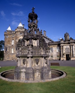 SCOTLAND, Lothian, Edinburgh, Holyrood House facade. Entrance door with ornate stone fountain in