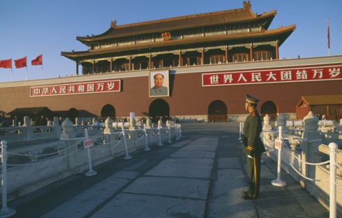 CHINA, Beijing, Tiananmen Square. Gate Heavenly Peace with soldier standing in the foreground