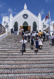 BERMUDA, St Georges Island, St Georges, Schoolchildren in uniform leaving St. Peters Cathedral.