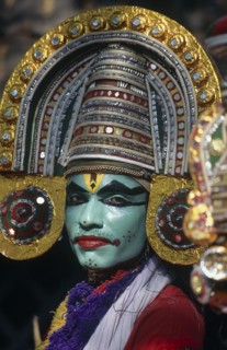INDIA, Kerala, Dance, Kathakali dancer in costume with green face makeup