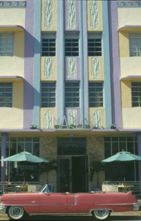 USA, Florida, Miami, Ocean Drive. Pink Cadillac parked outside Art Deco style Marlin Hotel on South