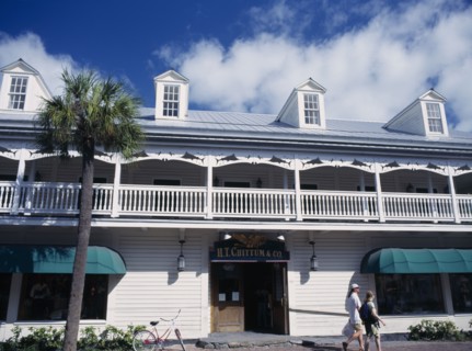 USA, Florida, Key West, Duval Street buildings with people walking past