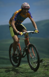 10065617 SPORT Cycling  Mountain Biking Young man on muddy mountain bike in the Lake District.