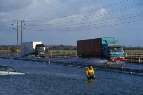 WEATHER , Rain, Flooding , Chichester by-pass with traffic driving through flood water