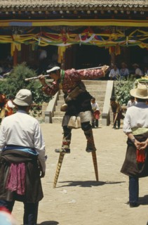 CHINA, Qinghai, Tongren, Tibetan stilt dancer at festival
