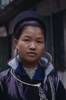 VIETNAM, North, Sa Pa, Portrait of Muong girl wearing large hooped earrings