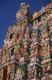INDIA, Tamil Nadu, Madurai, Sri Meenakshi Temple detail of brightly coloured gopuram exterior wall