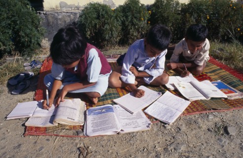 SRI LANKA, Children, Schools, "School children doing school work at a country school, outside on a