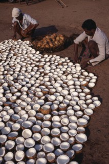 INDIA, Kerala , Varkala , Men preparing copra or dried coconut.