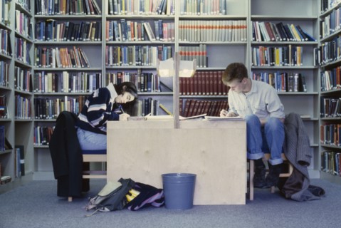 EDUCATION, Library, Oxford Library interior with students studying at desks surrounded by bookcases