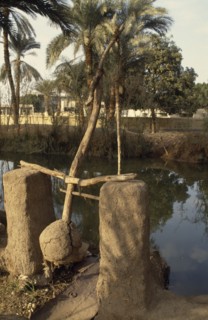 EGYPT, Nile Valley, Agriculture, Shaduf and irrigation canal.