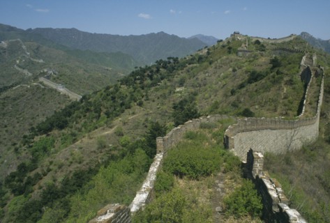 CHINA, Mutianyu, The Great Wall, View along the crumbling wall leading over hills in to the