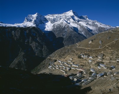 NEPAL, Sagarmatha National Park, Namche Bazar, Sherpa capital with Himalayan mountain peaks beyond.