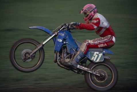 10039001 SPORT Motor Sport Moto Cross Competitor in motorcycle endurance race.