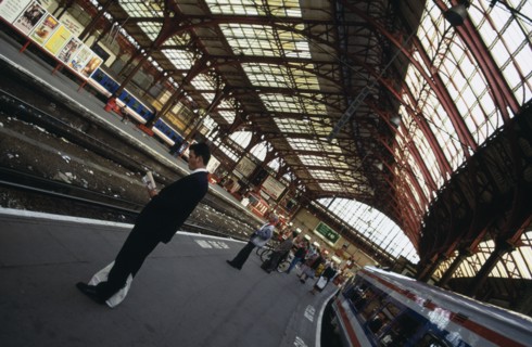 TRANSPORT, Rail, Station, Railway station with angled view of passengers waiting on empty platform